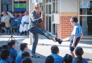 Governor of NSW Margaret Beazley and Holy Spirit Carness Hill student Nicholas doing karate moves